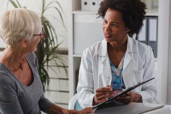 Senior female patient having a conversation with her doctor