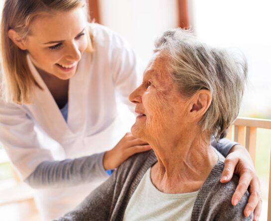 mature woman talking to a female healthcare professional
