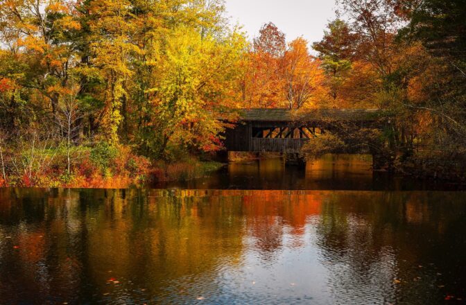 Scenic river and bridge with fall foliage in Wisconsin