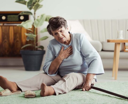 Hospice patient sitting on the floor