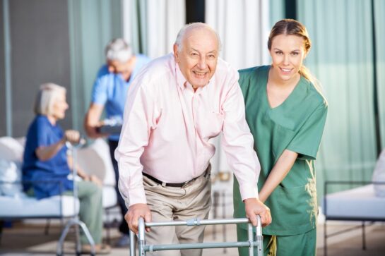 Hospice patient walking with nurse