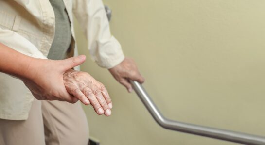 Hospice patient walking with help of nurse