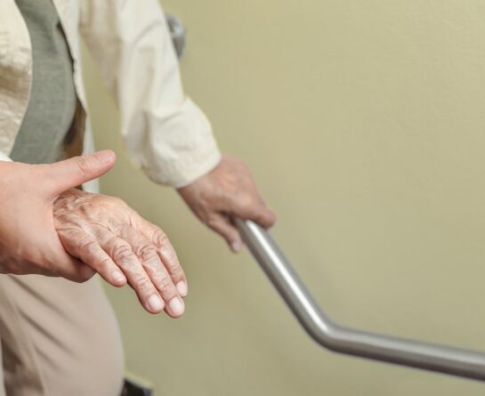 Hospice patient walking with help of nurse