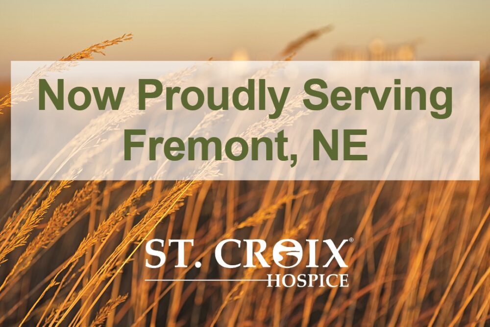 Text informing that St. Croix Hospice now serves Fremont with yellow wheat leaves in the background