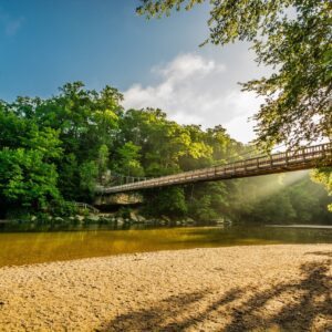 Indiana landscape with wooden bridge crossing a lake