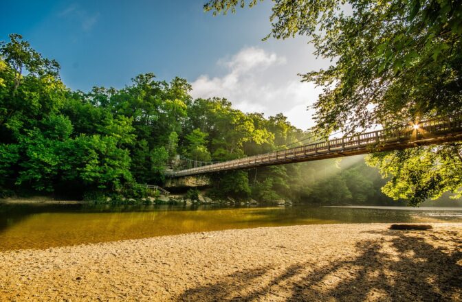 Indiana landscape with wooden bridge crossing a lake