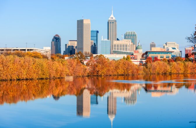 River fork in Indianapolis with autumn trees and downtown buildings in the back