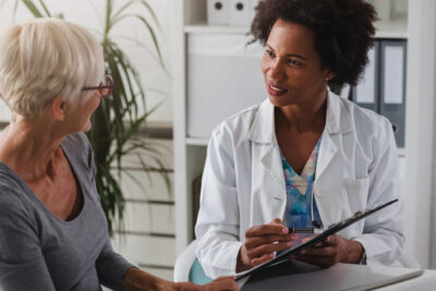 Senior female patient with female doctor at doctor's appointment